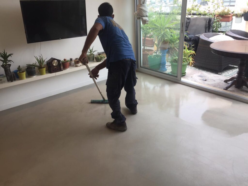 Person mopping modern apartment floor